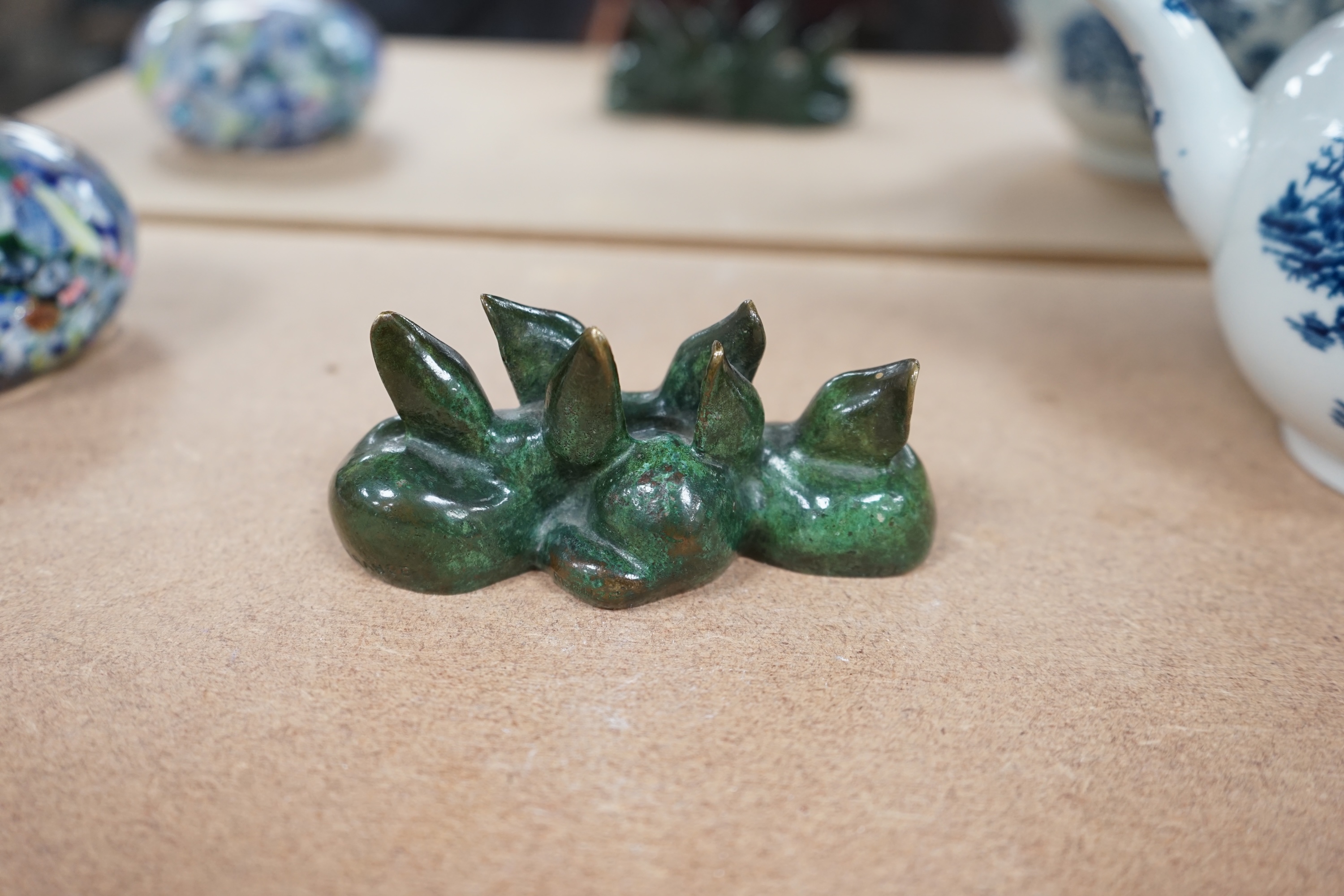 Raoh Schorr (1901-1991) A green patinated bronze group of three seated foxes signed Schorr, 11.5cm wide. Condition - good